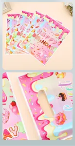 Detailed view of candy-themed birthday gift bags featuring colorful donut patterns