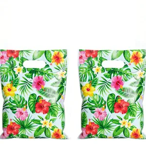Tropical hibiscus floral party gift bags with punch-hole handles on white background