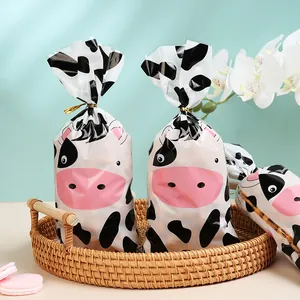 Cute cartoon cow print OPP packaging bags with gold twist ties for party candy gifts