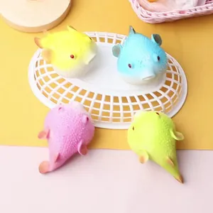 Set of colorful pufferfish squeeze toys in yellow blue pink and green for stress relief