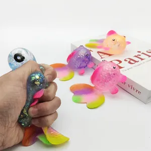 Detail showing the slow rebound texture of a squeezed maltose goldfish toy