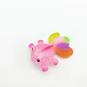 Detail view of a pink maltose goldfish squishy toy featuring a colorful rainbow tail