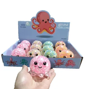 Macro view of a pink octopus stress relief toy filled with colorful foam micro beads