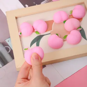 Niedliches rosa pfirsichförmiges TPR-Quetschspielzeug zum Stressabbau in Ästhetik