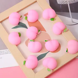 Set mit 10 niedlichen rosa Pfirsich-Knautschspielzeugen aus weichem TPR-Material