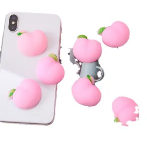 Niedliches rosa Pfirsich-Antistress-Spielzeug aus weichem TPR-Gummi fuer Smartphone