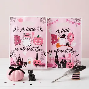 Detail of pink Halloween baby shower gift bags with cute ghost and pumpkin prints