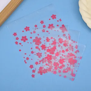 Sachets auto-adhésifs givrés fleurs de cerisier roses pour biscuits et emballages cadeaux