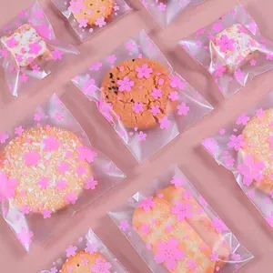 Frosted pink translucent cherry blossom self-adhesive packaging bags for cookies.