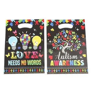Cadeauzakjes voor autismebewustzijn met kleurrijke puzzelpatronen voor goede doelen evenementen.