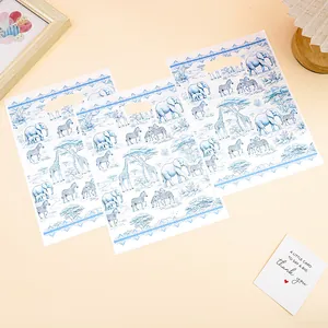 Three plastic gift bags with blue safari animal prints and handles for party favors
