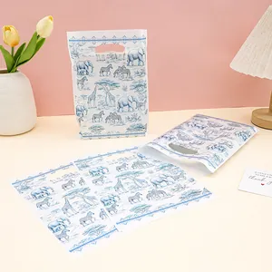 African savanna theme party gift bags with blue animal prints and cutout handles