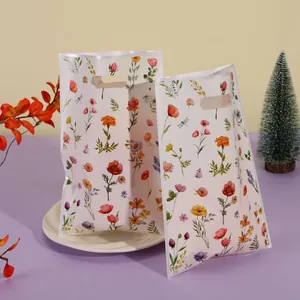 Florale Geschenktüten aus Perlmuttfolie für Kekse und Süßigkeiten mit Tragegriffen