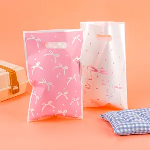 Bowknot pattern plastic gift bags for party favors and candy packaging 80-100 chars