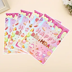 Set of 4 candy-themed Happy Birthday gift bags featuring sweet treat patterns for kids' parties