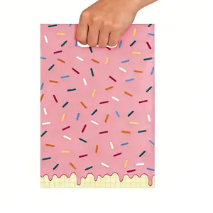 Vibrant pink plastic gift bag with colorful sprinkles pattern and handle for parties