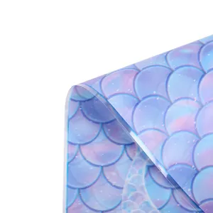 Close-up of holographic mermaid scale pattern on iridescent OPP candy packaging bag