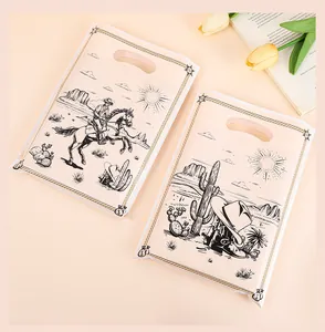 Detail van Wild West cowboy thema cadeauzakjes met bedrukking van paarden en hoeden