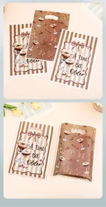 Detailed view of martini themed plastic treat bags with 'A tini Bit Older' slogan