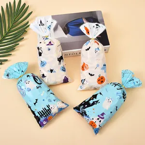 Halloween party candy gift bags with cute pumpkin and ghost prints on beige background