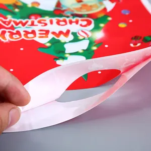 Sac cadeau de Noël festif avec motif Père Noël et finition nacrée pour les fêtes