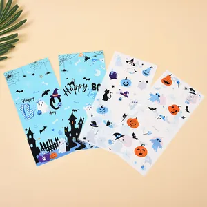 Assorted Halloween candy gift bags with ghost and pumpkin prints for party treats