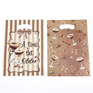 Martini themed plastic party treat bags with 'A tini Bit Older' print for gift favors