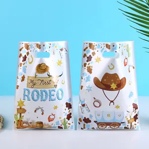 Cowboy hat themed party favor gift bags with My First Rodeo print design