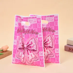 Pink breast cancer awareness gift bags featuring a large bow and 'No One Fight Alone' text