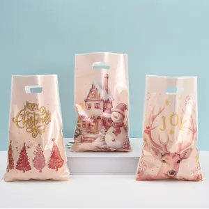 Set of pink pearlescent plastic Christmas gift bags with snowman and reindeer designs