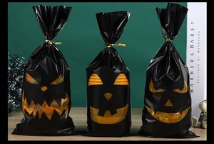 Trio of black Halloween treat bags featuring diverse orange pumpkin face designs.