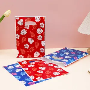 Hawaiian tropical leaf print plastic gift bags with die-cut handles for parties