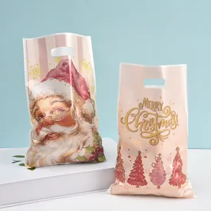 Pearly pink Christmas plastic gift bags featuring Santa Claus and festive tree motifs