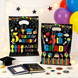 Festive black graduation party gift bags with colorful 5th grade print and school icons