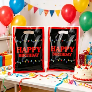 Festive black and red birthday gift bag with colorful light print and die-cut handle