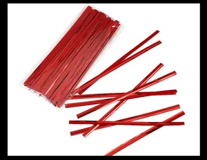 Detailed macro view of red metallic twist ties used for gift bags and food packaging sealing
