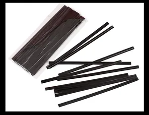 Detailed macro view of dark brown metallic twist ties for sealing packaging bags