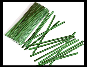 Detailed macro view of shiny green metallic twist ties for gift bag sealing and binding wire