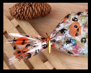 Detailed macro view of a golden metallic twist tie sealing a Halloween themed treat bag