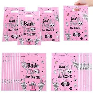 Pink 'Bad TWO the BONE' skeleton print gift bags for 2nd birthday party favors
