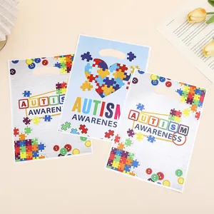 Plastic Autism Awareness gift bags featuring puzzle piece heart and colorful buttons