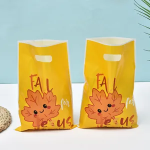 Cute yellow maple leaf gift bags with Fall for Jesus print for autumn party favors