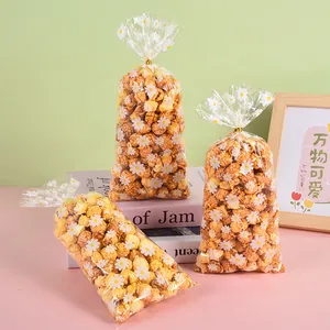 Premium clear OPP gift bags with white daisy print for snacks and candy packaging