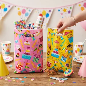 Kids birthday party gift bags with colorful cake and candy patterns in party scene.