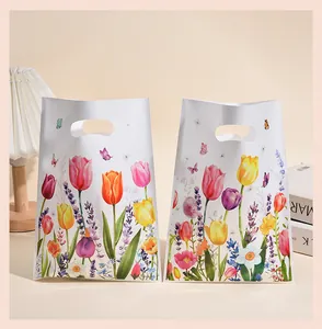 Macro view showing the detailed tulip floral print on pearlescent film gift bags