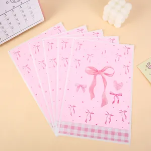 High quality pink bow pattern plastic gift bags for party favors and candy packaging