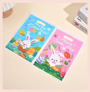 Vista detallada de lindas bolsas de regalo de Pascua con conejitos en rosa y azul.