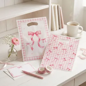 Cute pink bow checkered gift bags for party favors shown in a warm pink lifestyle setting