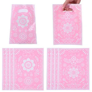 Pink Mexican folk art style plastic gift bags with die-cut handles for party favors