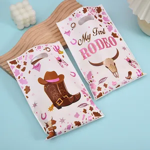 Roze cowboy thema My First Rodeo feestcadeauzakjes voor snoep en feestdecoratie